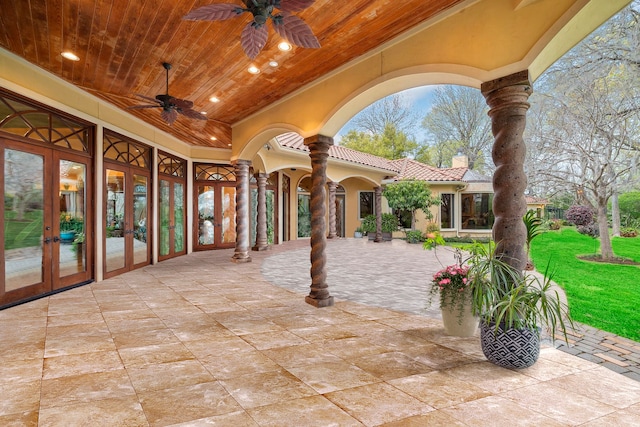 view of patio / terrace featuring ceiling fan and french doors