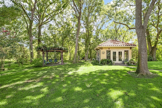 view of yard featuring french doors