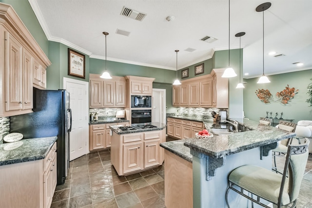 kitchen with a breakfast bar area, kitchen peninsula, hanging light fixtures, and black appliances