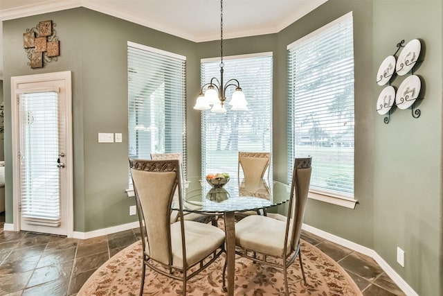 dining area featuring a notable chandelier and ornamental molding