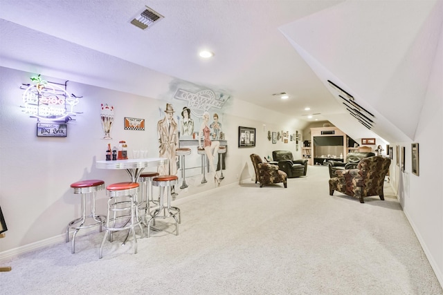 game room with light carpet and vaulted ceiling