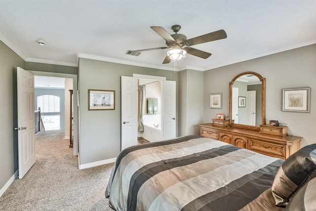 bedroom with ceiling fan, crown molding, ensuite bathroom, and light carpet