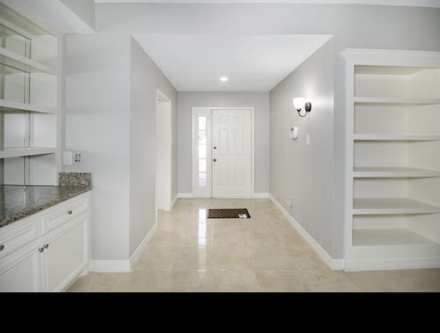 foyer entrance with light tile floors