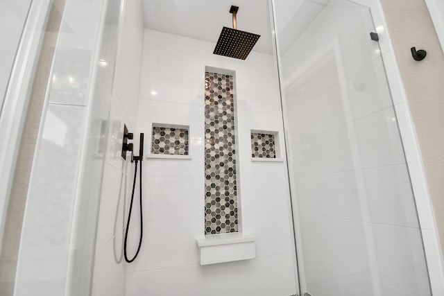 bathroom with tiled shower