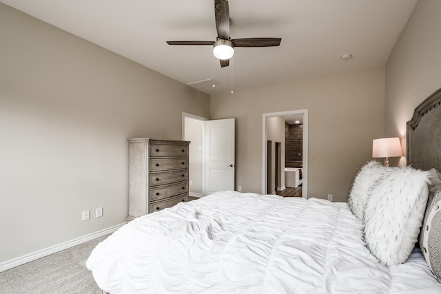 bedroom featuring ceiling fan, ensuite bathroom, carpet flooring, and baseboards