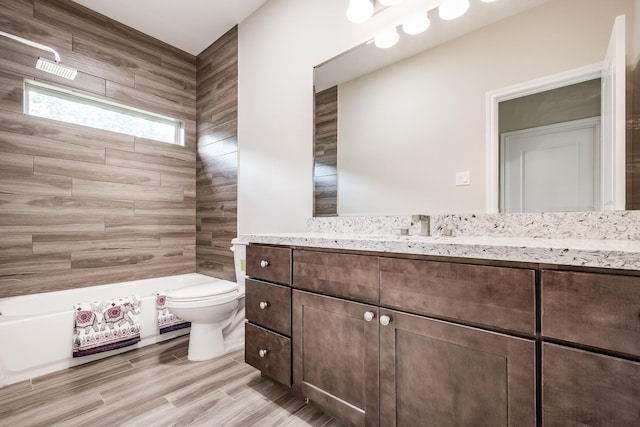 full bathroom featuring vanity, walk in shower, a bathtub, and toilet