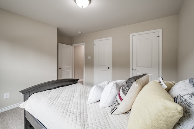 bedroom featuring light colored carpet