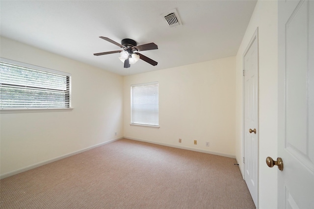 unfurnished bedroom featuring ceiling fan and light colored carpet