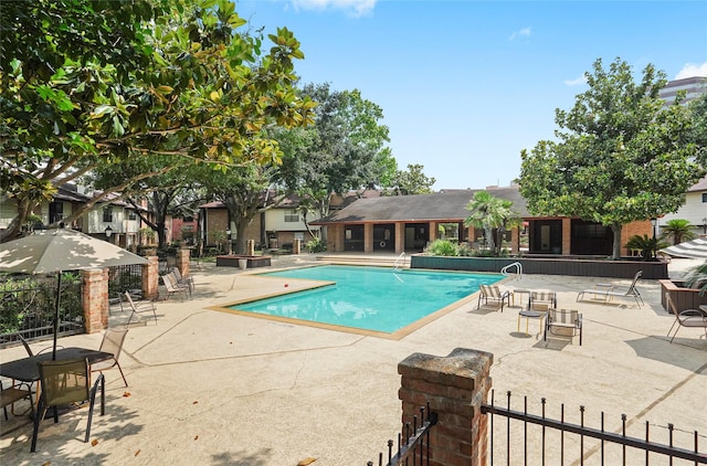 view of swimming pool with a patio area