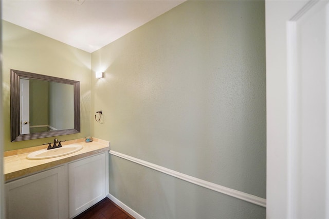 bathroom with wood-type flooring and vanity