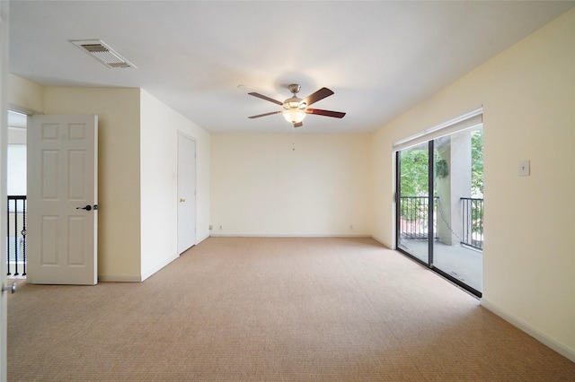 carpeted empty room with ceiling fan