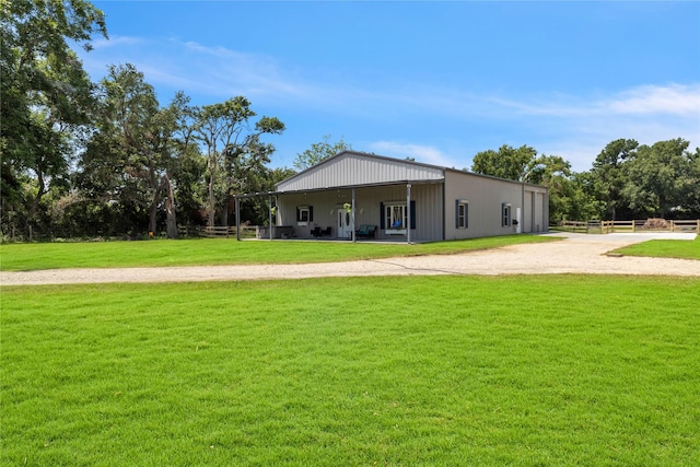 back of property with a yard