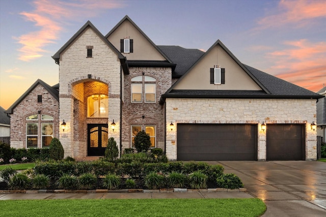 french country home with a garage