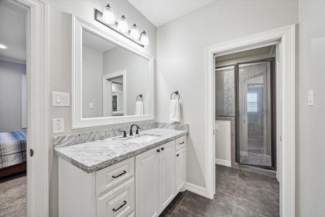 bathroom featuring tile patterned flooring and vanity