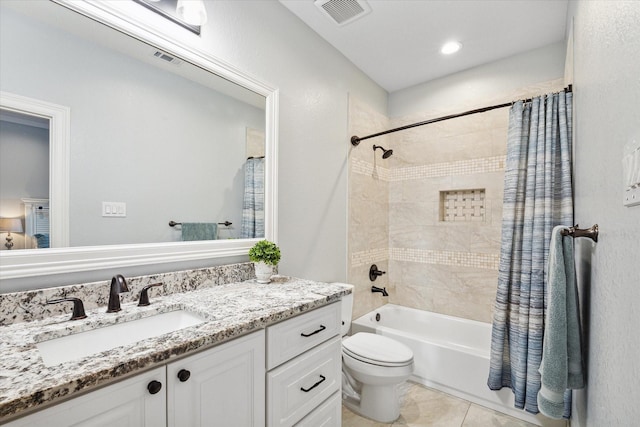 full bathroom with tile patterned flooring, vanity, shower / bath combination with curtain, and toilet