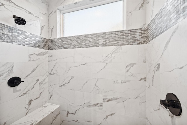 bathroom featuring tiled shower