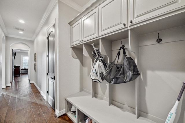 mudroom with dark hardwood / wood-style floors and crown molding