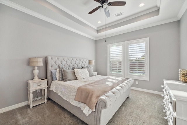 carpeted bedroom featuring a raised ceiling, ceiling fan, and crown molding