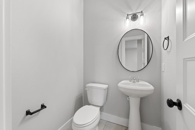 bathroom featuring tile patterned floors and toilet