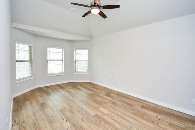 unfurnished room with ceiling fan, light hardwood / wood-style flooring, and vaulted ceiling