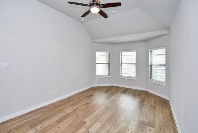 spare room featuring ceiling fan, light hardwood / wood-style flooring, and vaulted ceiling