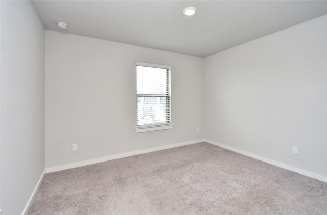 empty room with light colored carpet