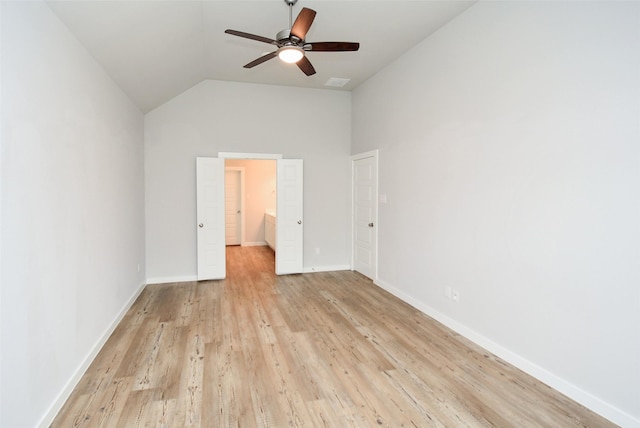 unfurnished bedroom with ceiling fan, light wood-type flooring, and lofted ceiling