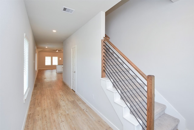 hall with light wood-type flooring