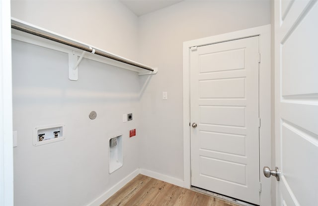 clothes washing area with hookup for a washing machine, light wood-type flooring, and electric dryer hookup