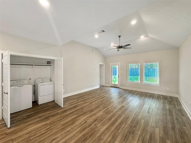 unfurnished living room featuring lofted ceiling, washing machine and dryer, hardwood / wood-style floors, and ceiling fan