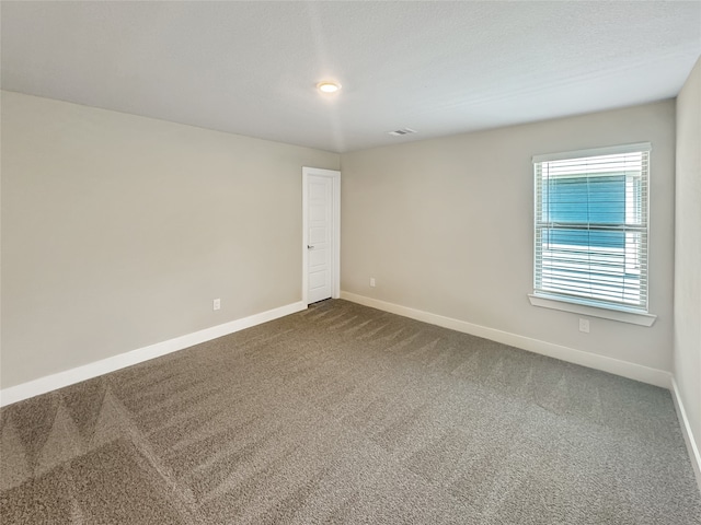 spare room featuring carpet flooring