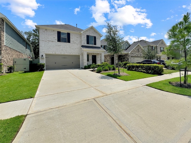 view of front of home with a garage and a front yard