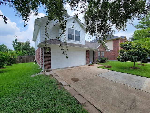 front of property with a garage and a front lawn