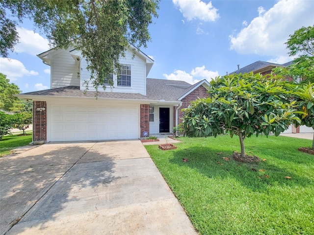 view of front of house featuring a garage and a front lawn