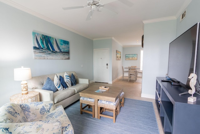 tiled living area featuring baseboards, a ceiling fan, visible vents, and crown molding