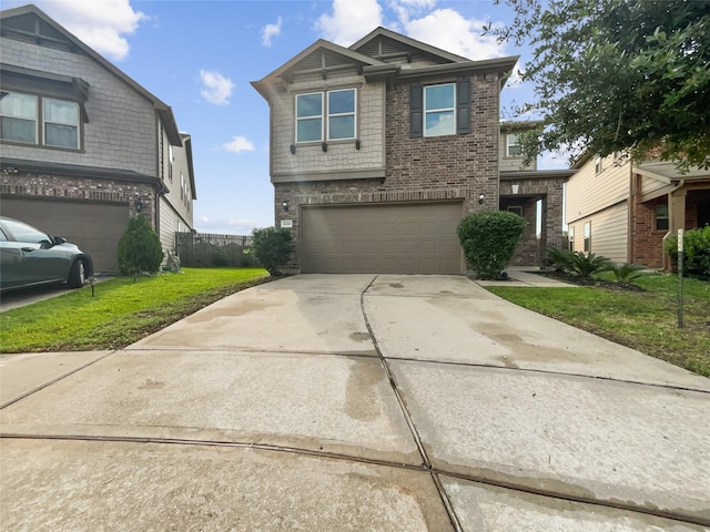 view of front of home with a garage and a front yard