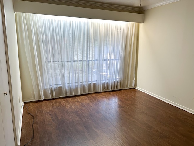 unfurnished room with crown molding and dark hardwood / wood-style flooring