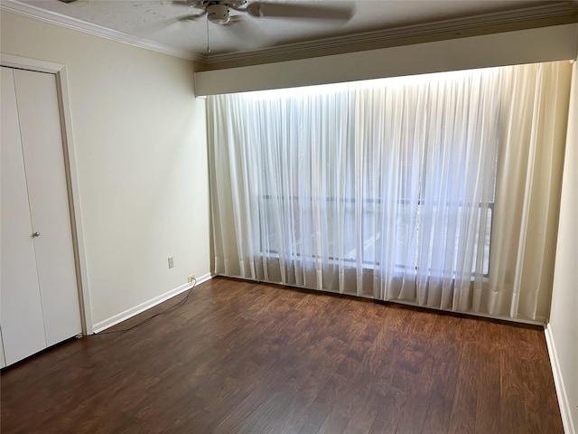 unfurnished bedroom with dark hardwood / wood-style flooring, crown molding, and ceiling fan