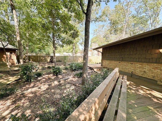 view of yard featuring a wooden deck