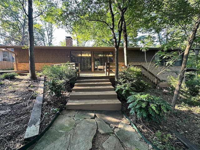 back of house with a sunroom