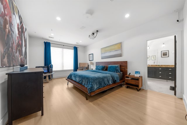 tiled bedroom featuring ensuite bathroom