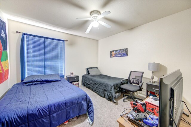 carpeted bedroom with ceiling fan