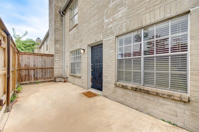 doorway to property featuring a patio area