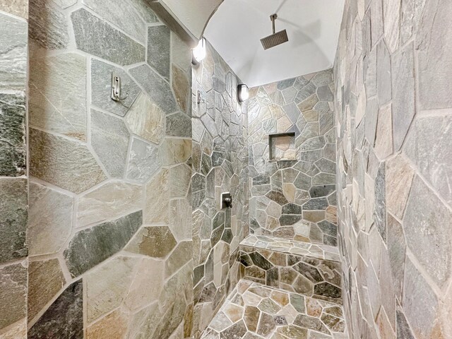 bathroom with a tile shower