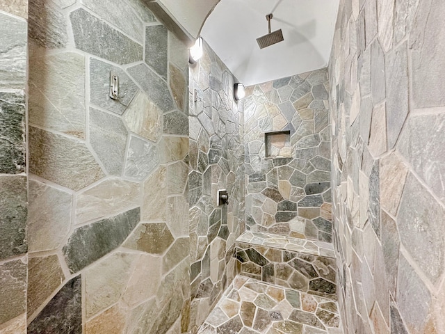 bathroom featuring tiled shower