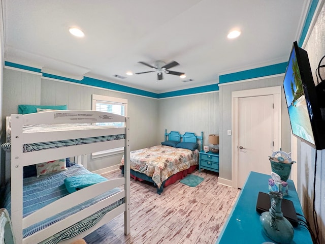 bedroom with ceiling fan and hardwood / wood-style flooring