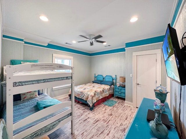 2025 Vista Dr, Crystal Beach, TX 77650 - bedroom with wood finished floors, recessed lighting, a ceiling fan, crown molding, and baseboards