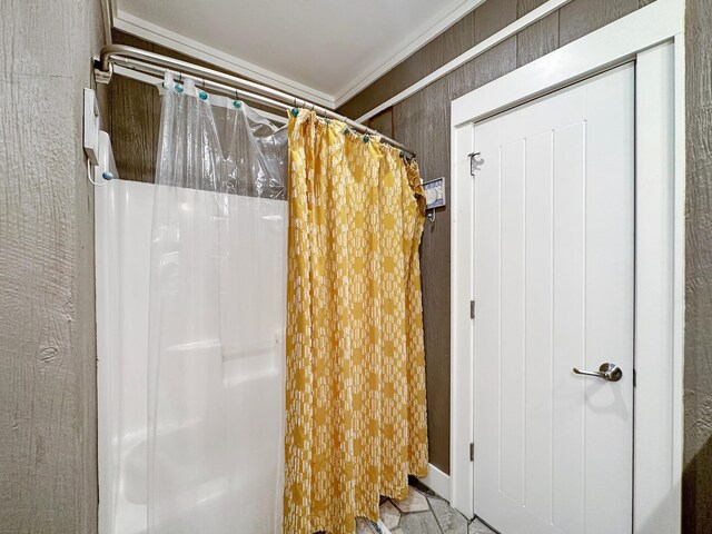 bathroom featuring tile flooring and ornamental molding