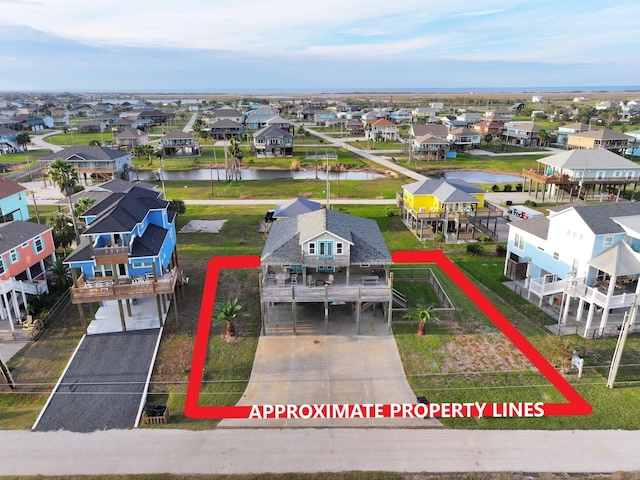 2025 Vista Dr, Crystal Beach, TX 77650 - aerial view of residential area featuring a large body of water