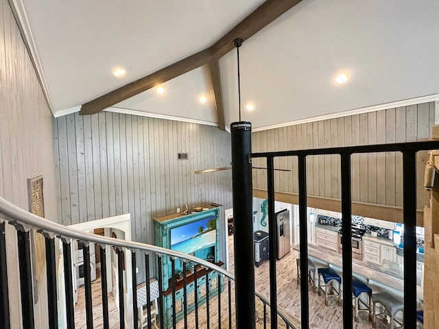 details with beamed ceiling, wooden walls, and hardwood / wood-style flooring